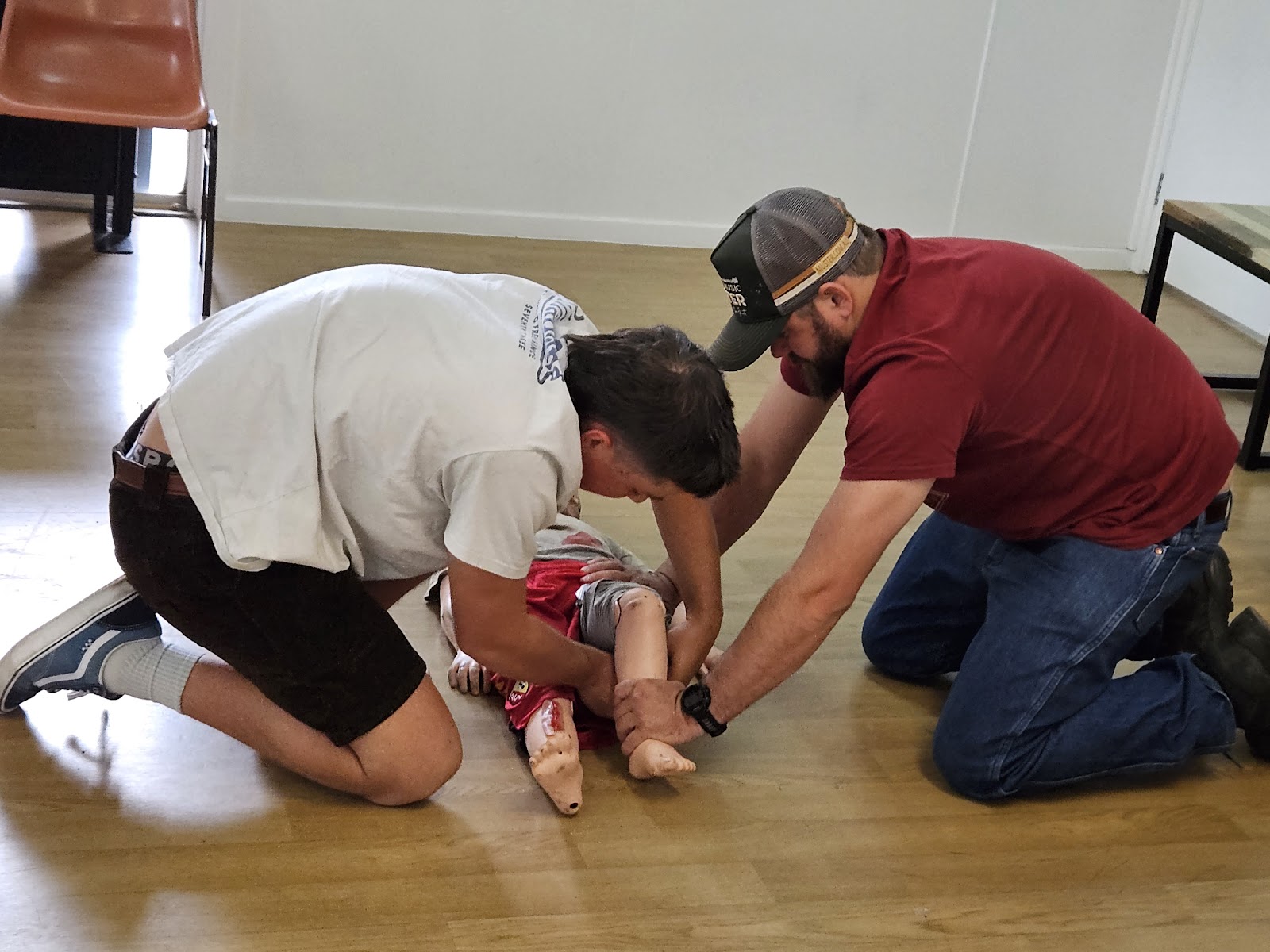 Participants also practice applying first aid techniques on children.